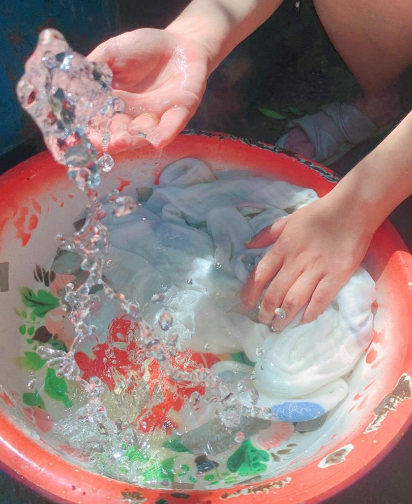 Hand washing a crochet dress in cold water to keep its shape